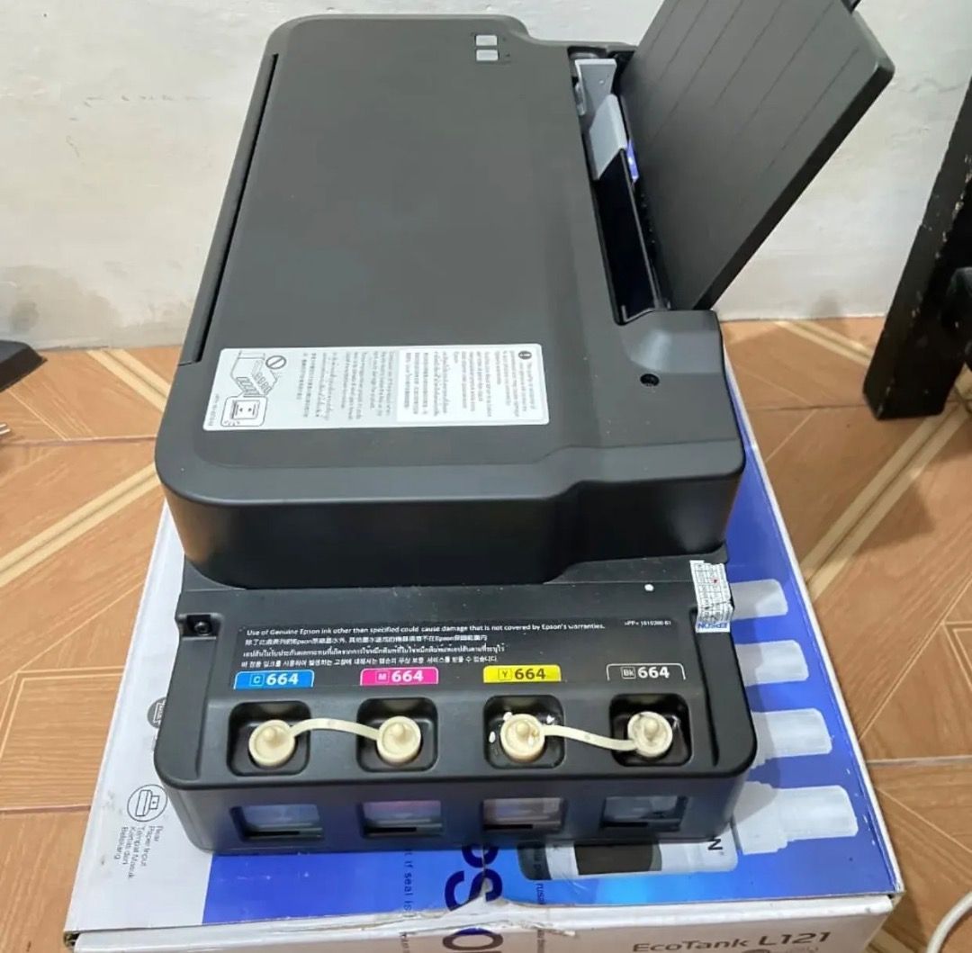 Epson EcoTank L121 Printer (Category: Printers, Scanners & Copiers) located in Caloocan City. Submitted by quickcloud_01b0c5 (Listing ID 1461550892, Image 2). Description: - Epson EcoTank L121 Printer - Includes ink tanks - Ideal for home or office use - Original box and packaging included - Ready to print.