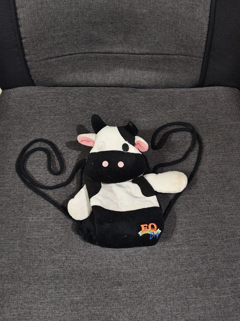 EQ Dry black and white cow plush backpack string shoulder straps (Category: Infant Playtime) located in Bulacan. Submitted by angel.decluttersx (Listing ID 1461483022, Image 1). Description: small size.