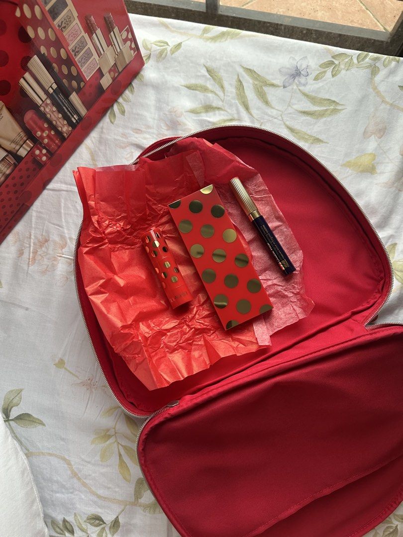 Estee Lauder Red Makeup Bag Set (Category: Makeup) located in Muntinlupa City. Submitted by pushpop02 (Listing ID 1461417824, Image 3). Description: - Brand new i have 2 stocks -Authentic Estee Lauder makeup and skincare set - Comes in a stylish red polka dot handbag (shaped like a real handbag!) - Includes: Eyeshadow palette, multiple lipsticks, lip gloss - Also features Estee Lauder skincare items - Makes a fantastic gift idea for beauty lovers