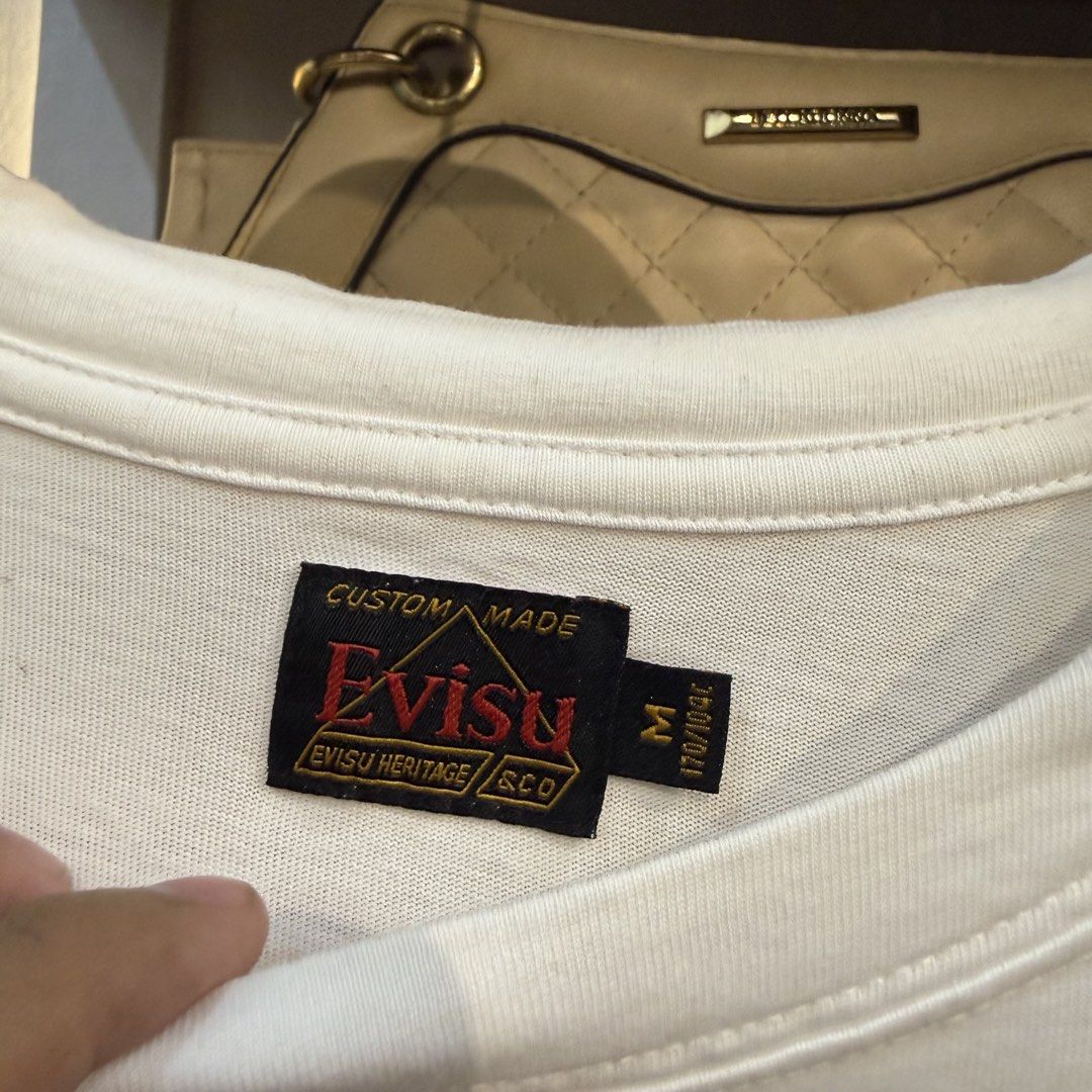 Evisu Custom Made T-shirt (Category: Tshirts & Polo Shirts ) located in Manila. Submitted by carbungcoalex (Listing ID 1461537182, Image 3). Description: EVISU DAICOCK WHITE SHIRT 20 by 27.5 Good Condition Complete tags 1K CLAIM.