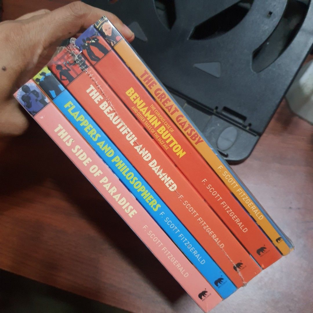 F. Scott Fitzgerald The Classic Collection Box Set (Category: Storybooks) located in Tarlac. Submitted by jajubells (Listing ID 1461367378, Image 2). Description: - Complete F. Scott Fitzgerald collection in a box set. - Includes: The Great Gatsby, Benjamin Button, The Beautiful and Damned, Flappers and Philosophers, and This Side of Paradise. - All books are still sealed in their original plastic wrap. - Box shows minor wear on the corners -seal
