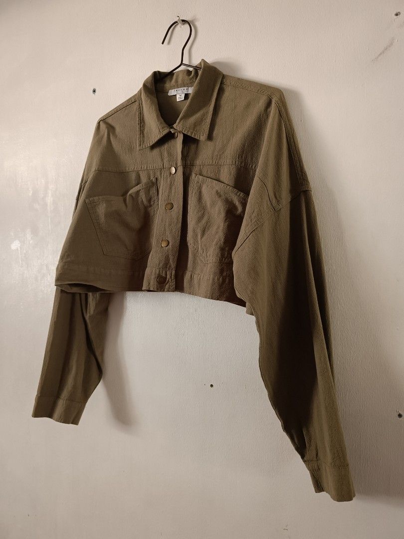 Favlux Olive Green Cropped Button-Up Jacket (Category: Coats, Jackets and Outerwear) located in Manila. Submitted by shajanina.14 (Listing ID 1461460050, Image 2). Description: Favlux Preloved As good as new Medium on the tag As per measuring tape, Bust- up to 48 inches Waist- up to 48 inches Length- 16 inches .