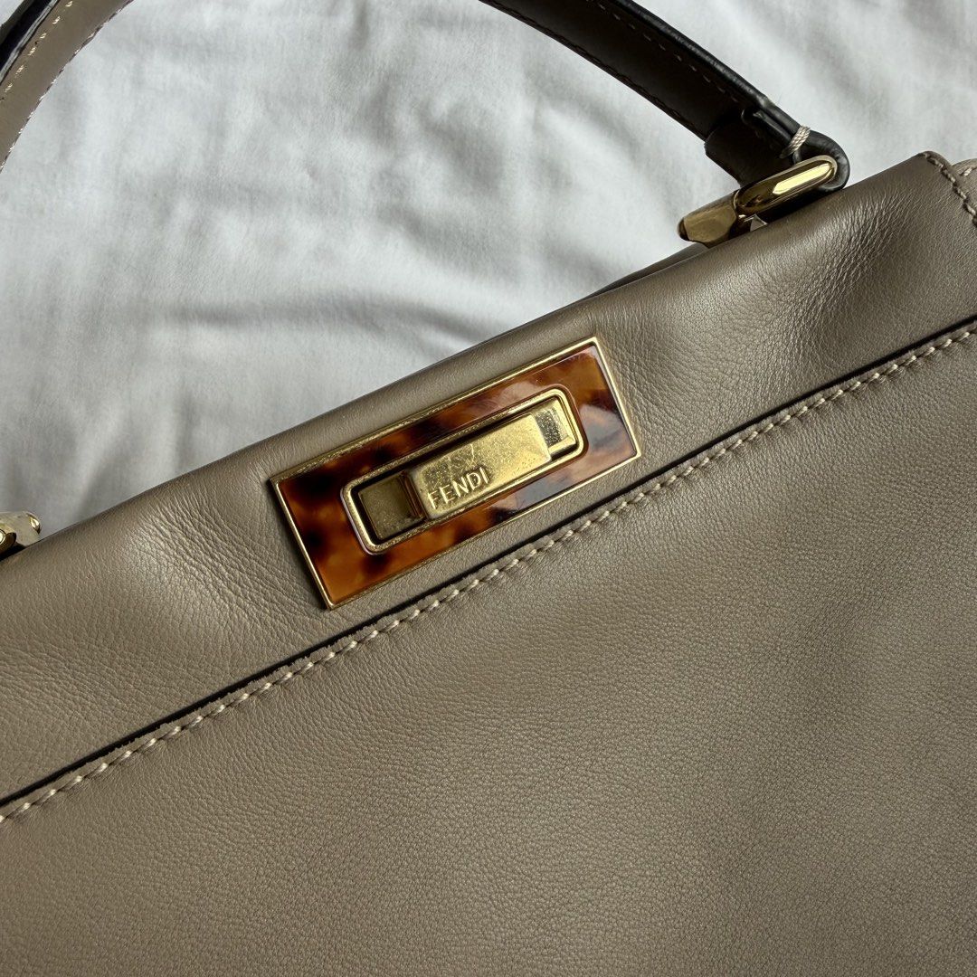 Fendi Peekaboo (Category: Luxury Bags & Wallets) located in Manila. Submitted by usetheoxfordcomma (Listing ID 1461484446, Image 2). Description: One side of the bag and the top handle have light cat scratches Bag is in otherwise great shape Comes with dust bag, strap, and paper bag.