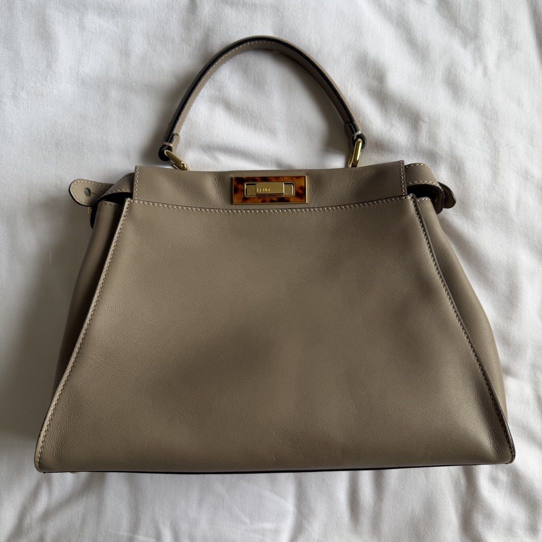 Fendi Peekaboo (Category: Luxury Bags & Wallets) located in Manila. Submitted by usetheoxfordcomma (Listing ID 1461484446, Image 1). Description: One side of the bag and the top handle have light cat scratches Bag is in otherwise great shape Comes with dust bag, strap, and paper bag.