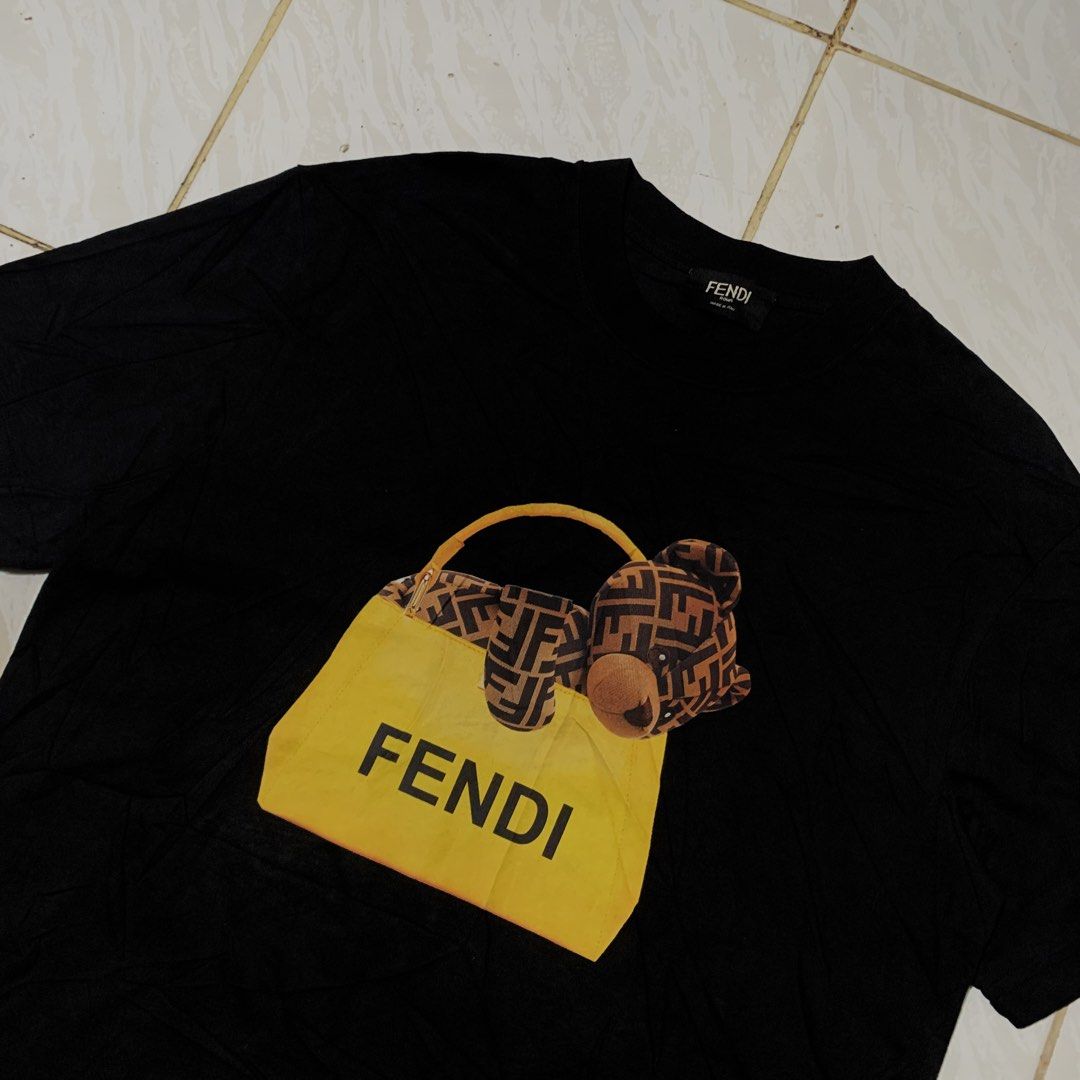 Fendi Tee (Category: Tshirts & Polo Shirts ) located in Cebu City. Submitted by johnferrer96412 (Listing ID 1461545828, Image 2). Description: Fendi Tee Medium to Large Width 21 Length 28 Excellent condition Dm📩.