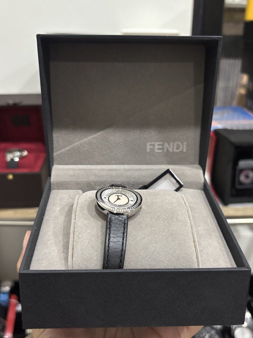 Fendi Watch with Leather Strap and Crystal Bezel (Category: Women's Watches) located in Malabon City. Submitted by everythingpreloveddd (Listing ID 1461329984, Image 2). Description: - Authentic Fendi Watch - White Mother-of-Pearl Dial - Silver-Tone Case - Crystal-Embellished Bezel - Black Leather Strap - Includes Original Fendi Box - Versatile for dressing up or everyday wear.
