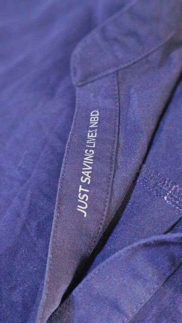 FIGS Technical Collection Scrub Top XL Navy Blue (Category: Activewear) located in Paranaque City. Submitted by JPNPH (Listing ID 1461369120, Image 3). Description: - Navy blue FIGS Technical Collection scrub top - Size XL - "Just Saving Lives NBD" detail inside - Ideal for healthcare professionals - Made in Vietnam.
