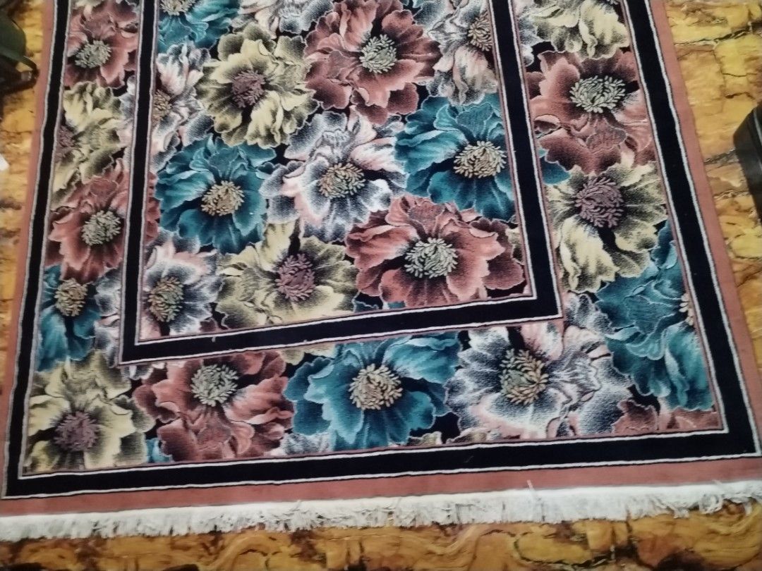 Floral Area Rug 79x96 (Category: Carpets, Mats & Flooring) located in Caloocan City. Submitted by rowely_jpn (Listing ID 1461460194, Image 2). Description: Japan surplus Large area rug with a vibrant floral pattern. Features shades of pink, blue, and yellow flowers. Has a dark border and fringed edges. Measures 79 by 96 inches. Adds color to any room. Great for living room or bedroom..