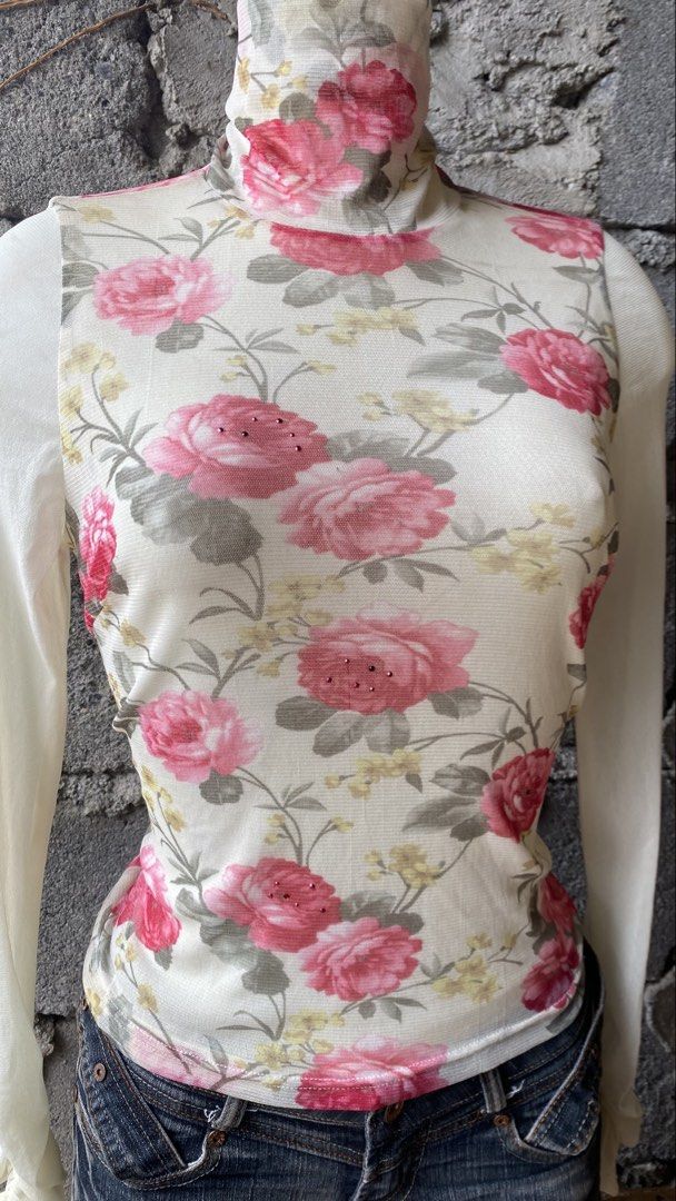 Floral Turtleneck Top (Category: Longsleeves) located in Davao. Submitted by calli_2219 (Listing ID 1461560731, Image 2). Description: - White turtleneck top - Pink and yellow floral print - ruffled cuffs - Scattered rhinestone details on floral design - Button closure at the back with keyhole cutout - Versatile: pair with jeans or a skirt for a chic look.