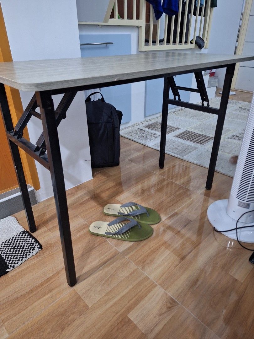 Foldable Table (Category: Tables & Sets) located in Antipolo. Submitted by blueverly (Listing ID 1461534654, Image 1). Description: Dimensions - 50x100 cm, Height 70cm - Foldable table, ideal for study or computer use. - Features a wood-grain finished tabletop. - Suitable for small spaces or as an extra surface..