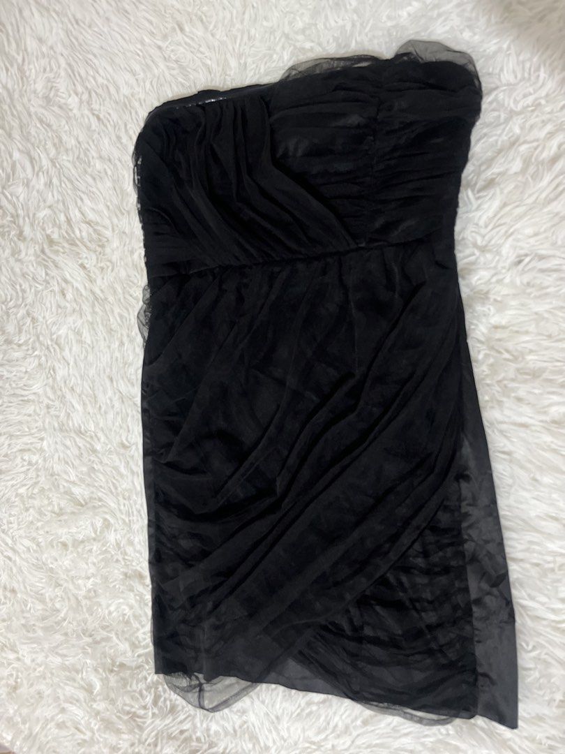 Forever 21 Black Strapless Tulle Ruched Mini Dress (Category: Dresses) located in Caloocan City. Submitted by safewind.d918ef (Listing ID 1461483021, Image 2). Description: - Black strapless mini dress - Brand: Forever 21 - Features: Ruched tulle overlay, sweetheart neckline, draped skirt effect - Style: Perfect for parties or nights out - Condition: Please check photos for details.