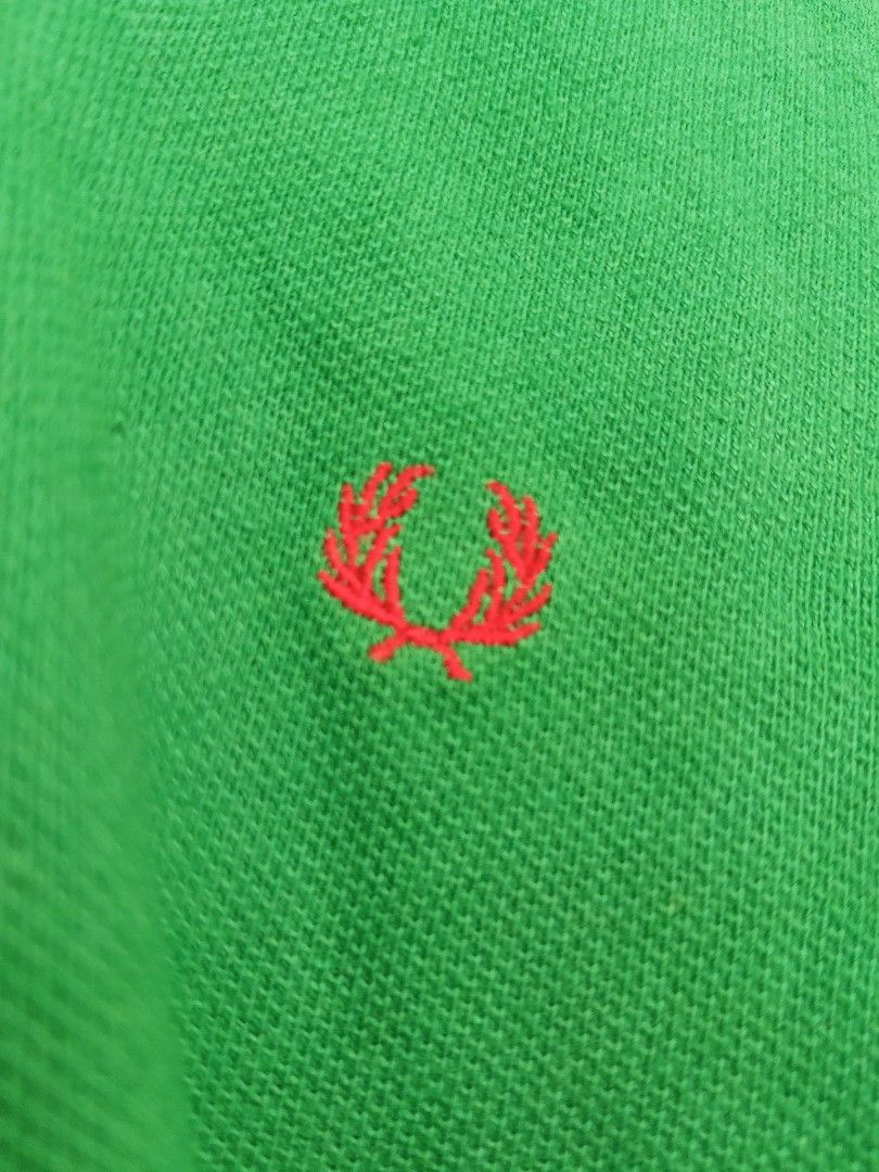 Fred Perry Green Polo Shirt M (Category: Shirts) located in Davao. Submitted by carnopaul76938 (Listing ID 1461491189, Image 3). Description: - Brand: Fred Perry - Color: Green - Size: Medium (M) women - Features: Iconic red laurel wreath logo - Details: Red and white trim on collar and cuffs - Material: 100% Cotton Pique - Style: Casual wear.