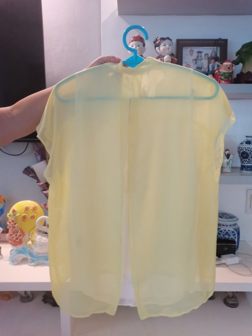 FREE if you bought 2 or more items (Category: Blouses) located in Dipolog. Submitted by true.brclo_thing (Listing ID 1461441361, Image 2). Description: - Light yellow sheer blouse - Mandarin collar - Button-down front - Cap sleeves - Slightly curved hem - Lightweight material, ideal for warm weather - Easy to style with various bottoms - size M.