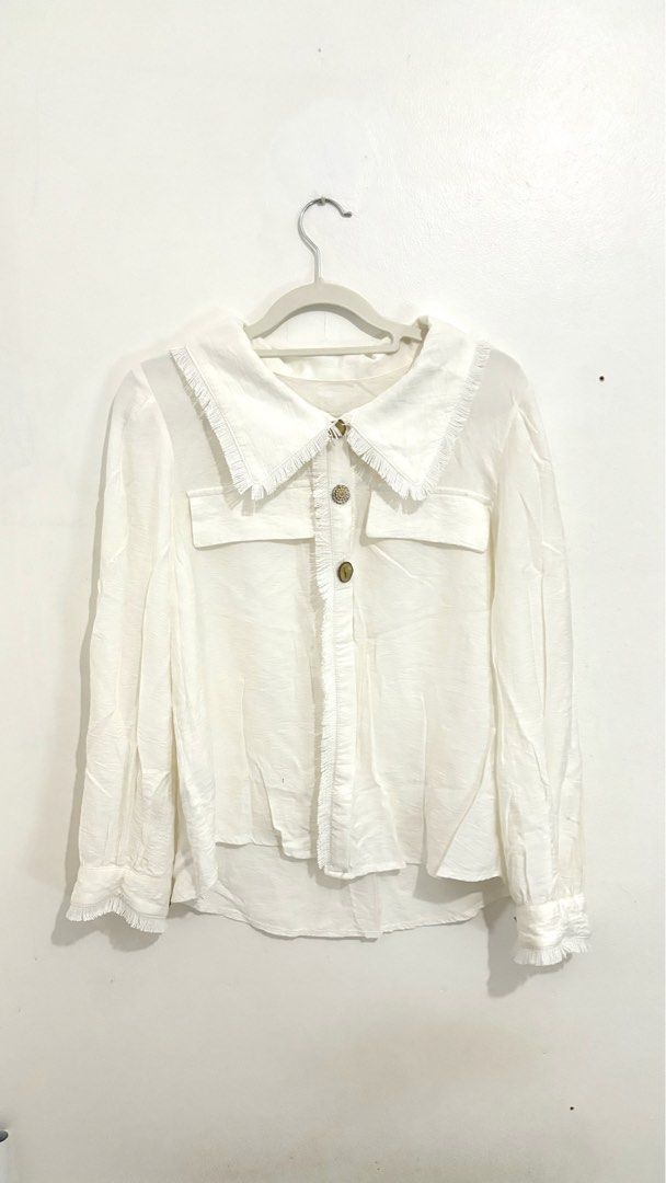 Fringe-Trimmed Wide-Collar Button-Down Blouse (Category: Longsleeves) located in Caloocan City. Submitted by buymethisandthat (Listing ID 1461401506, Image 1). Description: ✨ Fringe-Trimmed Wide-Collar Button-Down Blouse - ₱129 📌 CONDITION • Condition: 8/10 • Flaws: faint discoloration mark near sleeve area 📏 SIZE • Tag Size: No size tag • Recommended: Fits Small to Medium .