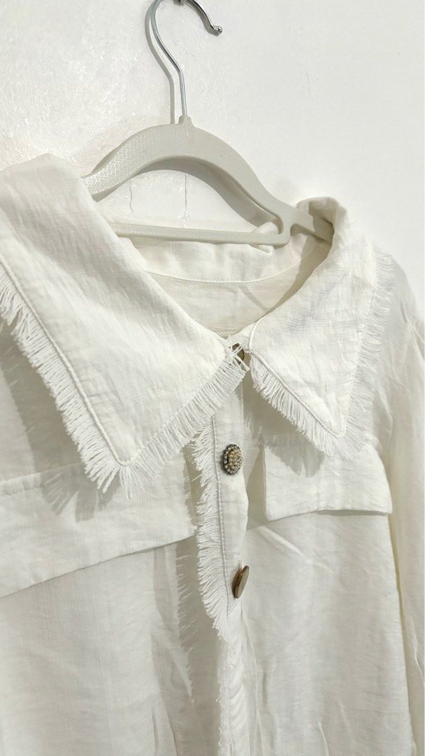 Fringe-Trimmed Wide-Collar Button-Down Blouse (Category: Longsleeves) located in Caloocan City. Submitted by buymethisandthat (Listing ID 1461401506, Image 2). Description: ✨ Fringe-Trimmed Wide-Collar Button-Down Blouse - ₱129 📌 CONDITION • Condition: 8/10 • Flaws: faint discoloration mark near sleeve area 📏 SIZE • Tag Size: No size tag • Recommended: Fits Small to Medium .