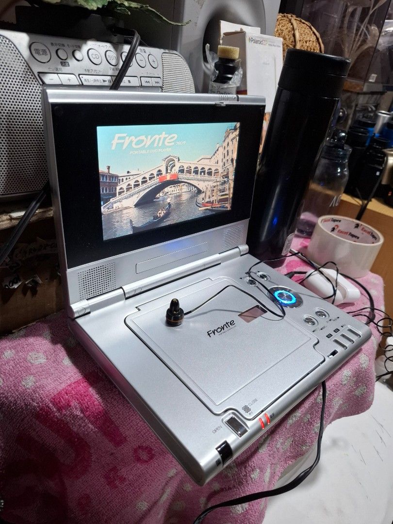 Frontier Portable DVD Player with Screen (Category: CDs & DVDs) located in Santa Rosa. Submitted by echojapansurplus_01 (Listing ID 1461428516, Image 3). Description: - Frontier Portable DVD Player - Built-in screen for on-the-go viewing - Includes earphones - Power adapter included - Tested and working - Ideal for travel or personal use..