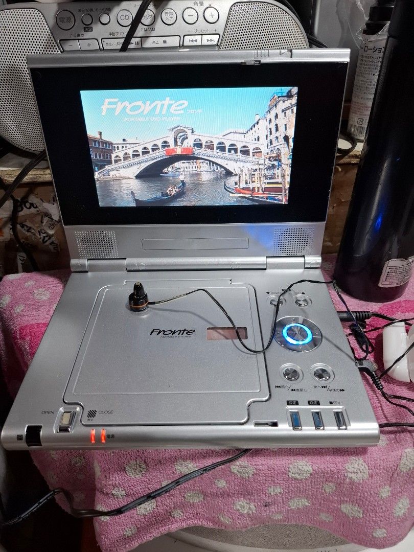 Frontier Portable DVD Player with Screen (Category: CDs & DVDs) located in Santa Rosa. Submitted by echojapansurplus_01 (Listing ID 1461428516, Image 1). Description: - Frontier Portable DVD Player - Built-in screen for on-the-go viewing - Includes earphones - Power adapter included - Tested and working - Ideal for travel or personal use..