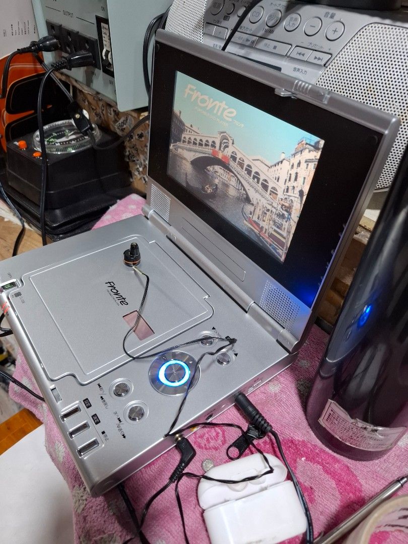 Frontier Portable DVD Player with Screen (Category: CDs & DVDs) located in Santa Rosa. Submitted by echojapansurplus_01 (Listing ID 1461428516, Image 2). Description: - Frontier Portable DVD Player - Built-in screen for on-the-go viewing - Includes earphones - Power adapter included - Tested and working - Ideal for travel or personal use..