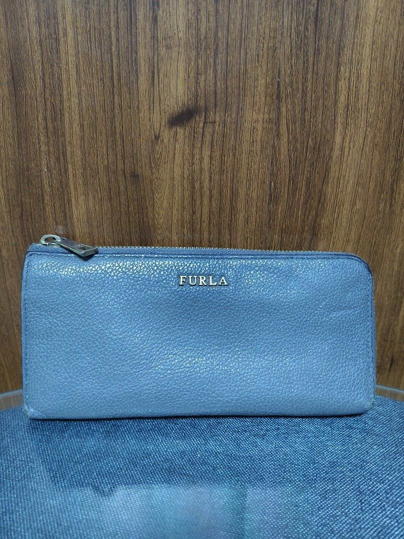 Furla Pebbled Leather Zip-Around Long Wallet (Category: Luxury Bags & Wallets) located in Baguio. Submitted by PreiLoveMaria (Listing ID 1461409020, Image 2). Description: Furla Pebbled Leather Zip-Around Long Wallet ​ Good used condition with normal signs of wear, including edge rubbing. ​Details: Crafted from premium pebbled leather, featuring gold-tone Furla-engraved hardware, a secure zip-around closure, and an organized multi-compartment int