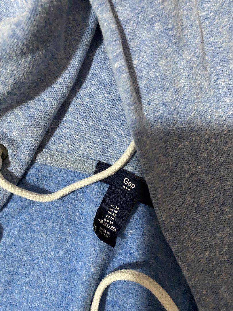 Gap Blue Heathered Zip-Up Hoodie (Category: Hoodies) located in Cebu City. Submitted by kishamarie07012 (Listing ID 1461474432, Image 2). Description: - Classic blue heathered zip-up hoodie from Gap - Iconic Gap logo across the chest - Comfortable and casual, perfect for everyday wear - Features drawstring hood and full zip closure - Size: Medium.