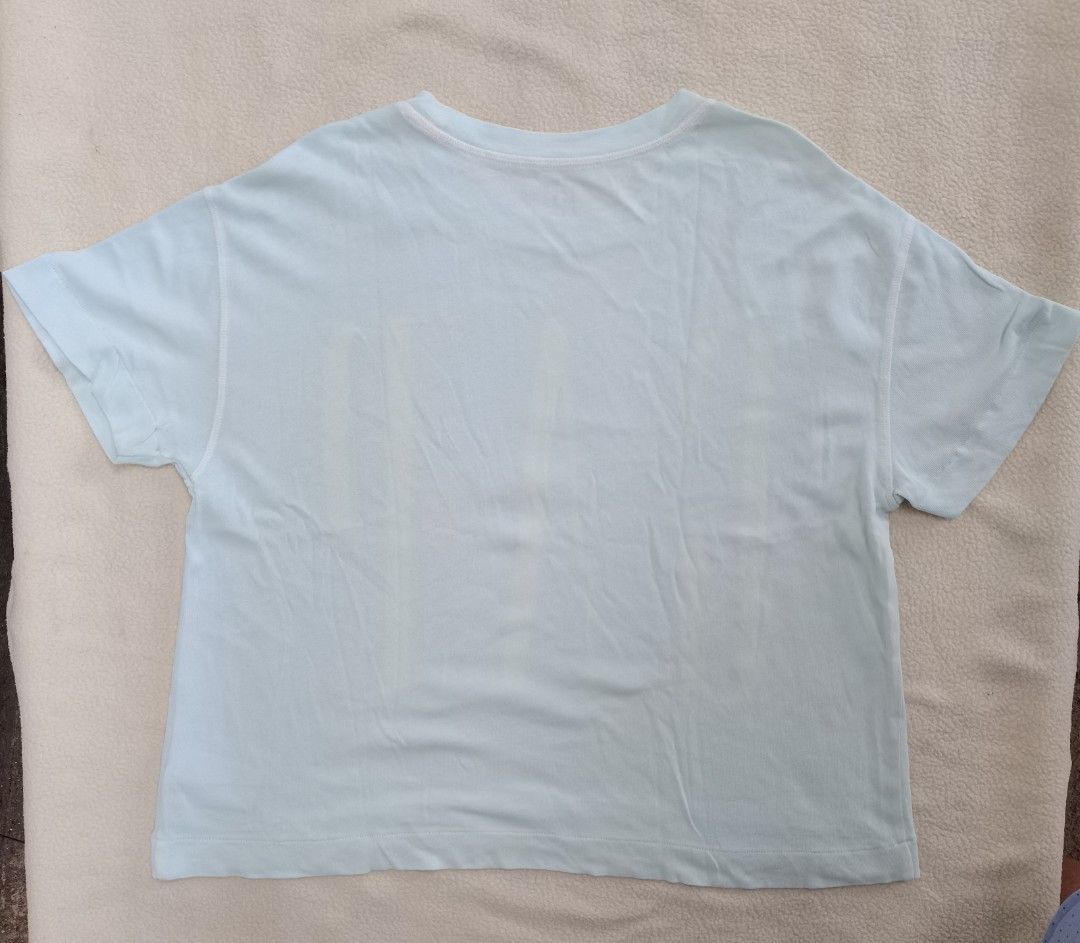 GAP short-sleeve graphic t-shirt. (Category: Shirts) located in Santa Cruz. Submitted by oddpenguin-4575 (Listing ID 1461523419, Image 3). Description: 📌.....P L E A S E R E A D..... 📌measurement:Laid flat Sh-20.5"/Sleeve-7"/Chest-17.5"/Lenght-23"/armhole-7"/armpit-8.5" 📌size:this shirt is a Filipino Women's Size Small (S), 📌color-10/10 📌Brand: GAP 📌Pattern/Style: Solid light mint green (or very pale blue/aqua) with a bold, oversized yellow