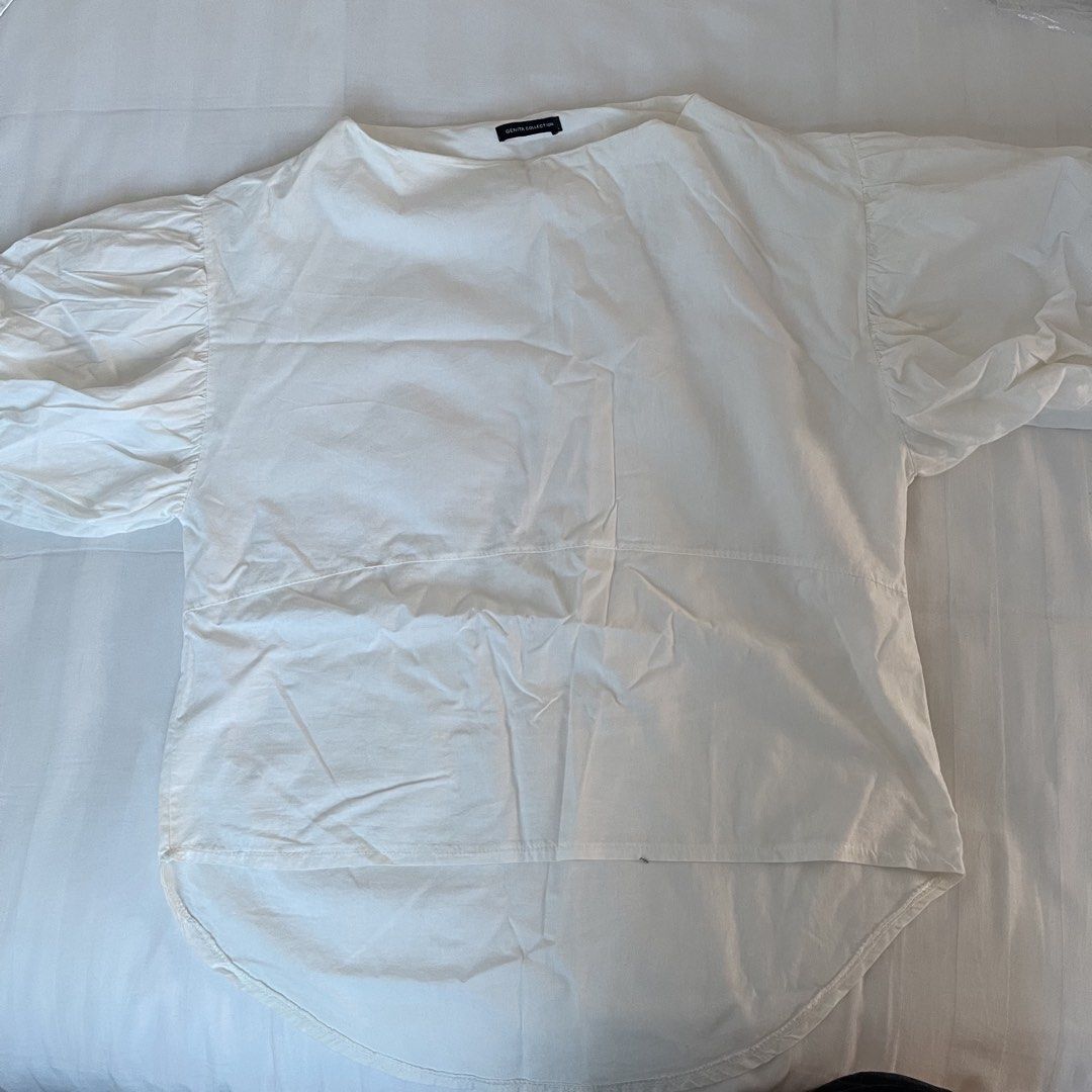 Genita Collection White Puff Sleeve Top (Category: Blouses) located in Muntinlupa City. Submitted by sza1123 (Listing ID 1461412294, Image 1). Description: - White top from Genita Collection - Features stylish puff sleeves - Relaxed fit for comfort - Curved hemline, longer at the back - Simple and versatile design - Easy to style for various occasions - Ideal for everyday wear.