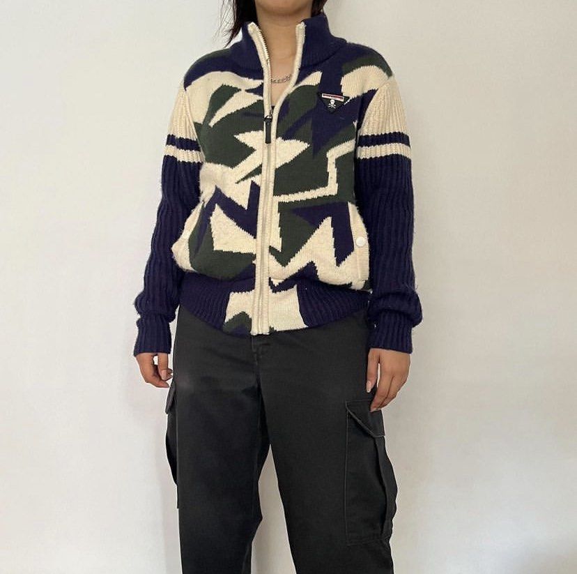 Geometric Zip-Up Knit Sweater (Category: Coats, Jackets and Outerwear) located in Manila. Submitted by beefparatha (Listing ID 1461396160, Image 1). Description: - Stylish geometric knit sweater - Zip-up front closure - Ribbed cuffs and hem for a snug fit - Color palette: Navy blue, green, and cream - Versatile for layering or standalone wear - Perfect for a casual, fashionable look.