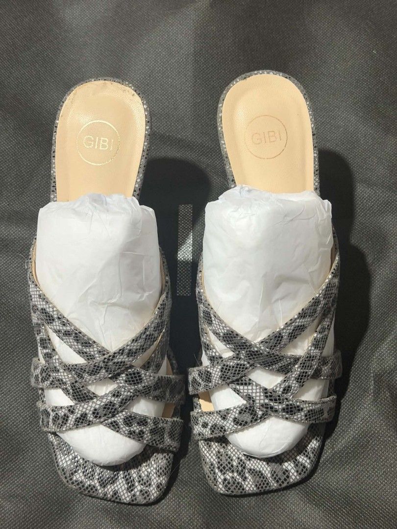 Gibi BOA 11 Gray Heels Size 36 (Category: Heels) located in Tagum. Submitted by kimbrookshieldlazaro (Listing ID 1461500183, Image 3). Description: - Gibi heels in size 36 - Stylish gray snake print pattern - Chic strappy design with a square toe - Includes original box and packaging - Perfect for elevating any outfit.