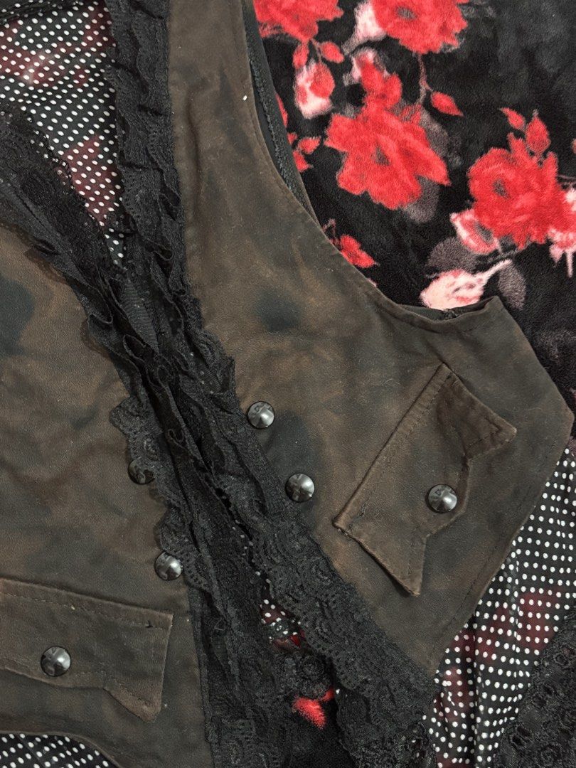 Gothic Lace Trimmed Brown Vest with Polka Dot Lining (Category: Sleeveless) located in Cavite. Submitted by raf.nomnom (Listing ID 1461398397, Image 2). Description: - Cool brown vest - Black lace trim detail - Unique polka dot lining peeking out - Two button pockets on the front - Buttons up the middle - Ideal for layering - Adds an edgy vibe to any outfit.