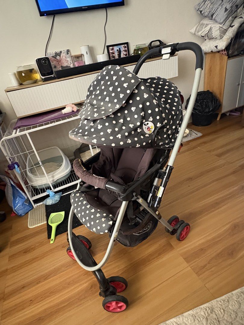 Graco Mickey Mouse stroller (Category: Strollers) located in Manila. Submitted by cbcollection_ (Listing ID 1461324876, Image 3). Description: - Adorable Mickey Mouse design - Reversible canopy with fun polka dots - Secure 5-point safety harness - Folds compactly for easy storage - Perfect for park strolls and errands - Minor wear on frame, fully functional.