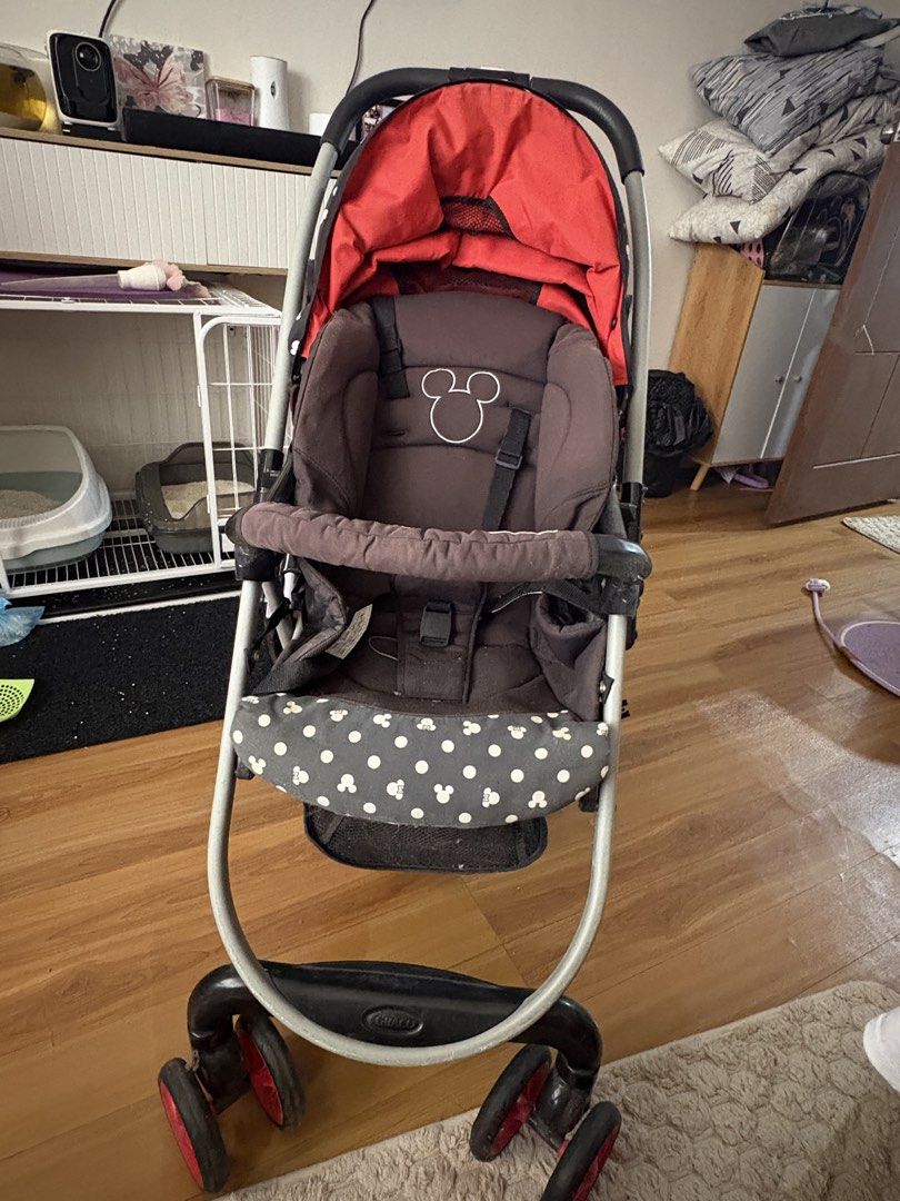 Graco Mickey Mouse stroller (Category: Strollers) located in Manila. Submitted by cbcollection_ (Listing ID 1461324876, Image 1). Description: - Adorable Mickey Mouse design - Reversible canopy with fun polka dots - Secure 5-point safety harness - Folds compactly for easy storage - Perfect for park strolls and errands - Minor wear on frame, fully functional.