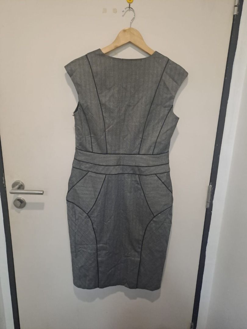 Gray bodycon dress (Category: Dresses) located in Mandaluyong City. Submitted by epicowl-c93c (Listing ID 1461458459, Image 3). Description: This JASPER grey business sheath dress features a structured, professional design accented by distinct black contour piping. It is styled with cap sleeves, a clean split-front V-neckline, and strategic seam paneling engineered to contour a tailored, figure-hugging silhouette..