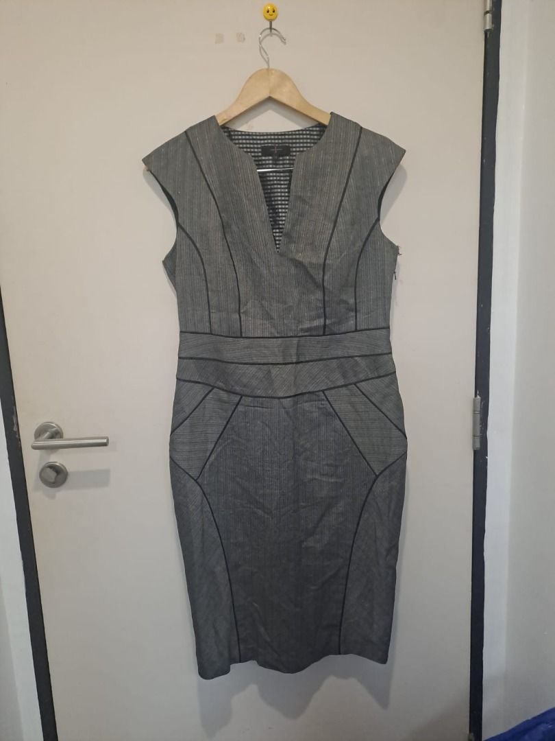 Gray bodycon dress (Category: Dresses) located in Mandaluyong City. Submitted by epicowl-c93c (Listing ID 1461458459, Image 1). Description: This JASPER grey business sheath dress features a structured, professional design accented by distinct black contour piping. It is styled with cap sleeves, a clean split-front V-neckline, and strategic seam paneling engineered to contour a tailored, figure-hugging silhouette..