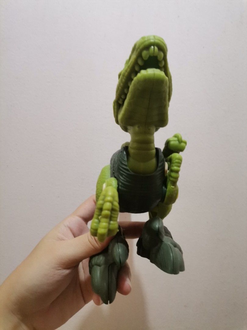 Green Dinosaur Action Figure Toy (Category: Action & Battle Toys) located in Makati City. Submitted by kookybearsstuff (Listing ID 1461411086, Image 3). Description: - Green dinosaur toy - Articulated arms and legs - Mouth opens and closes - Made of durable plastic - Ideal for imaginative play and fun for kids.