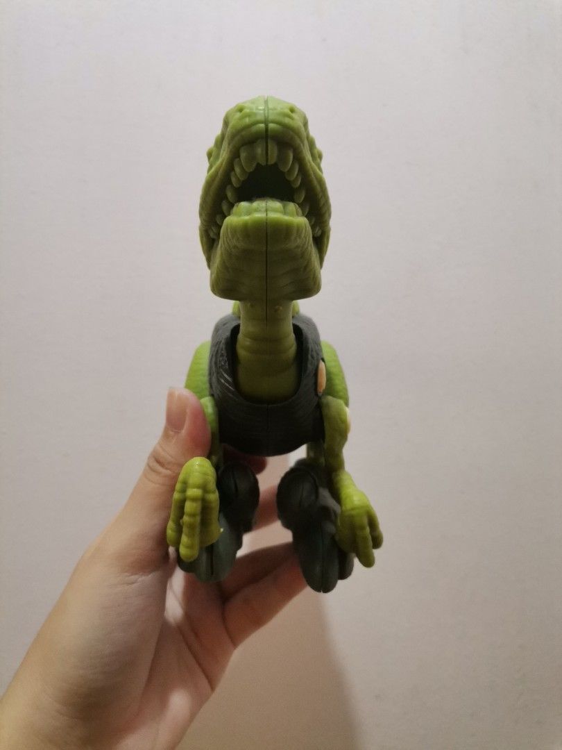 Green Dinosaur Action Figure Toy (Category: Action & Battle Toys) located in Makati City. Submitted by kookybearsstuff (Listing ID 1461411086, Image 2). Description: - Green dinosaur toy - Articulated arms and legs - Mouth opens and closes - Made of durable plastic - Ideal for imaginative play and fun for kids.