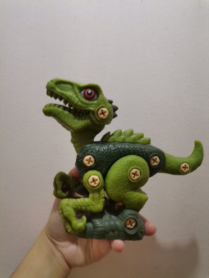 Green Dinosaur Action Figure Toy (Category: Action & Battle Toys) located in Makati City. Submitted by kookybearsstuff (Listing ID 1461411086, Image 1). Description: - Green dinosaur toy - Articulated arms and legs - Mouth opens and closes - Made of durable plastic - Ideal for imaginative play and fun for kids.