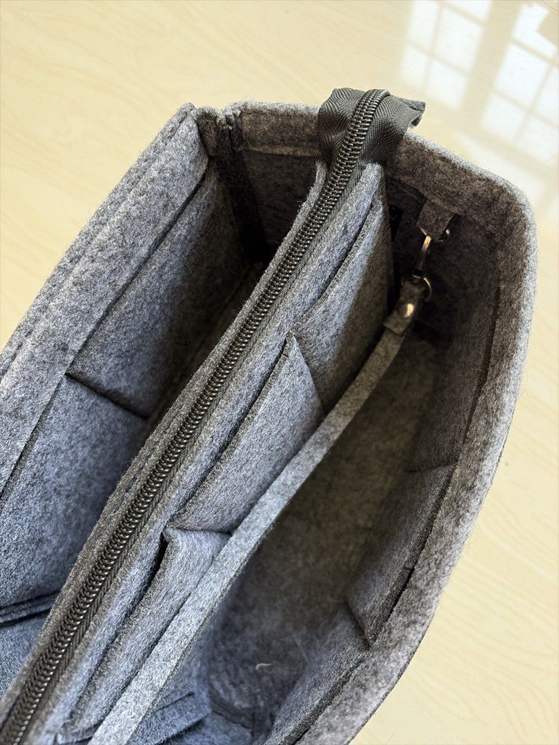 Grey Felt Bag Organizer Insert with Zipper Pockets (Category: Accessory Holder, Box & Organizers) located in Bulacan. Submitted by aarchive (Listing ID 1461351005, Image 3). Description: - Keep your large tote bags tidy and organized. - Features multiple interior pockets for easy storage of essentials. - Includes a main zippered compartment for added security. - Designed to fit perfectly in larger tote bags. - Ideal for everyday use and quick acc
