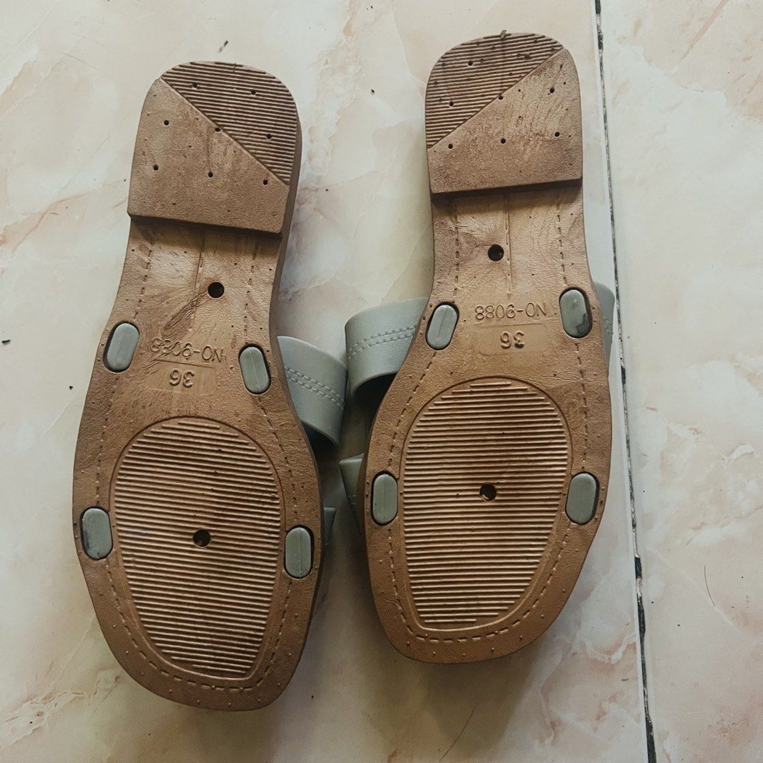 Grey H-Strap Flat Sandals (Category: Flats & Sandals) located in Marikina City. Submitted by kzells13 (Listing ID 1461339677, Image 2). Description: - Grey flat sandals - H-strap design - Easy slip-on style - Size 36 - Soles show some wear, but plenty of life left - Perfect for casual outings.