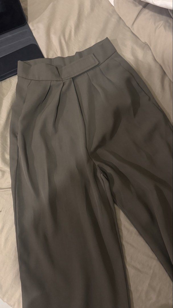 Grey Pleated Wide Leg Trousers (Category: Other Bottoms) located in Manila. Submitted by flyingyvon (Listing ID 1461522818, Image 2). Description: - Stylish grey trousers - Wide leg cut - High-waisted design - Front pleats for a structured silhouette.