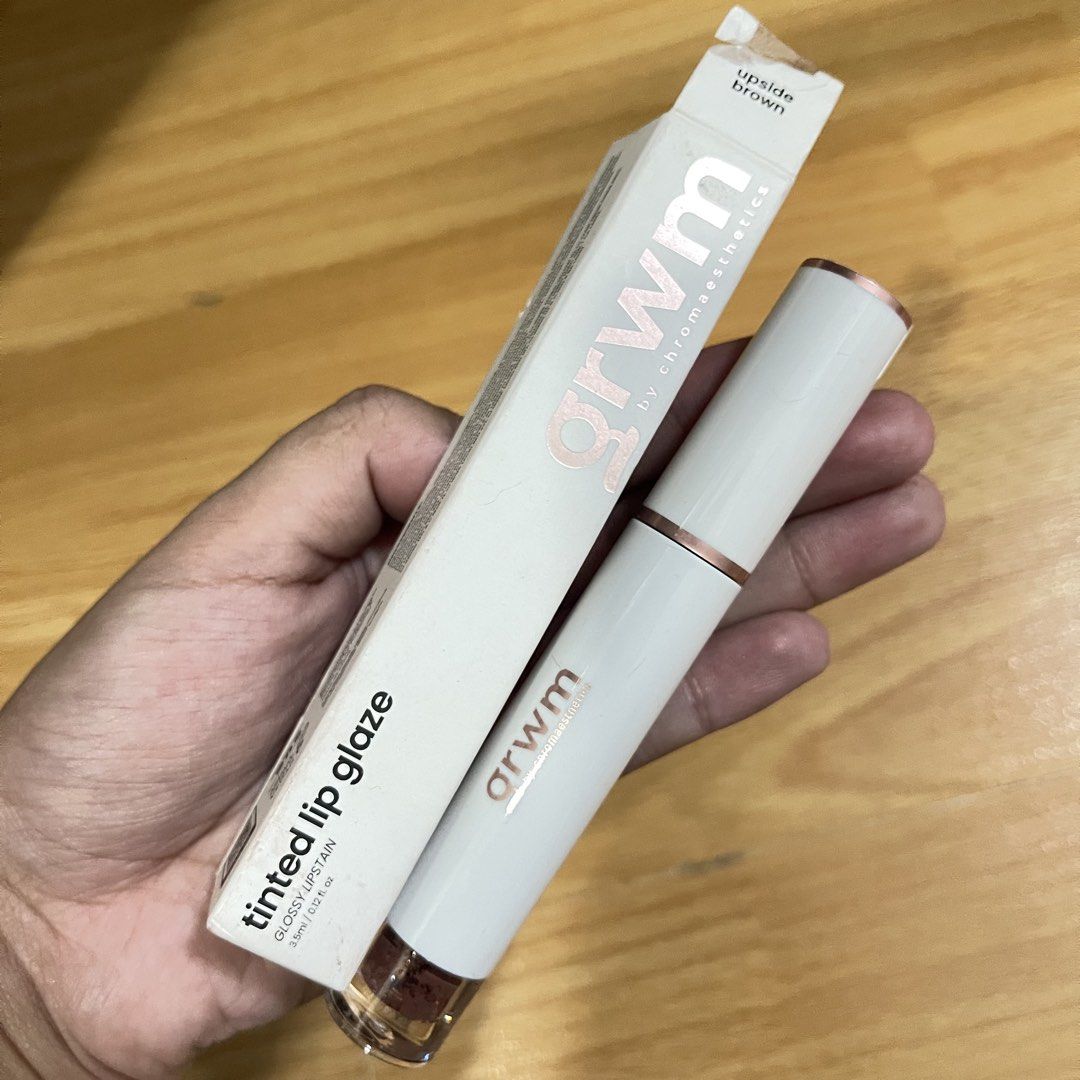 GRWM Tinted Lip Glaze in Upside Brown (Category: Makeup) located in Quezon City. Submitted by ukhy_shop (Listing ID 1461486545, Image 1). Description: - GRWM Tinted Lip Glaze - Shade: Upside Brown - Formula: Glossy Lipstain - Condition: Comes in original packaging, only swatched the product 🛒— ₱120 ONLY dm to avail ‼️.