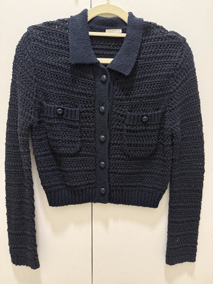 GU Knit Button Up Cardigan (Category: Coats, Jackets and Outerwear) located in Noveleta. Submitted by andreapallera (Listing ID 1461481421, Image 1). Description: - Navy blue GU crochet knit cardigan - Collared neckline - Button-up front closure - Two chest pockets with button details - Cropped length - Material: Polyester and Nylon blend - Ideal for layering outfits.