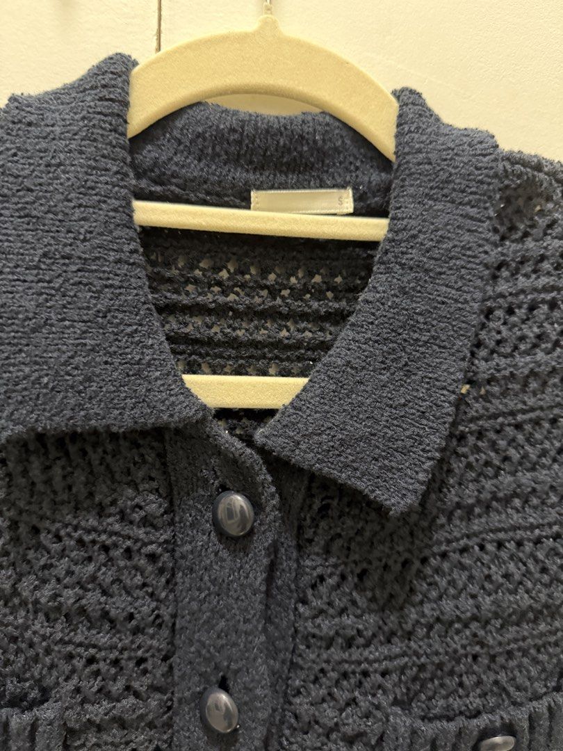 GU Knit Button Up Cardigan (Category: Coats, Jackets and Outerwear) located in Noveleta. Submitted by andreapallera (Listing ID 1461481421, Image 3). Description: - Navy blue GU crochet knit cardigan - Collared neckline - Button-up front closure - Two chest pockets with button details - Cropped length - Material: Polyester and Nylon blend - Ideal for layering outfits.