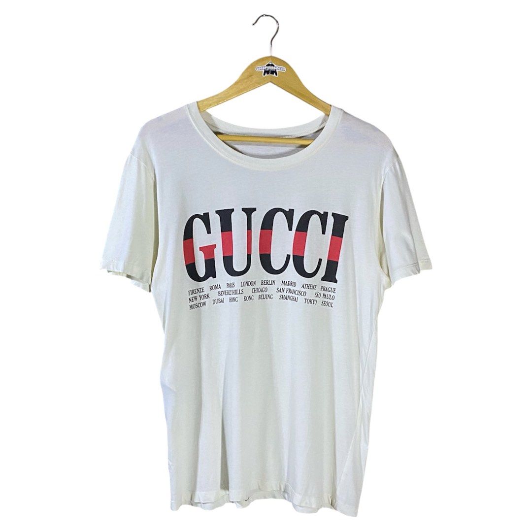 Gucci Cities Shirt (Category: Luxury Apparel) located in Baguio. Submitted by goodfinds2600v2 (Listing ID 1461517484, Image 1). Description: Size on tag: XS fits M-L Dimensions: L-28 W/Bust-19.5 Description: unisex, offwhite colorway Condition: Very good Issue/s: missing necktag .