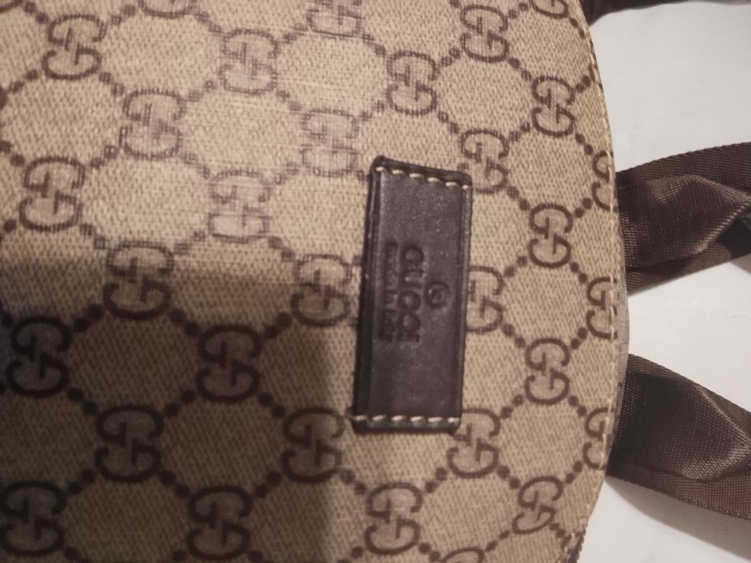 Gucci GG Monogram Backpack (Category: Luxury Bags & Wallets) located in Talisay. Submitted by southernthrifts (Listing ID 1461499930, Image 2). Description: - Iconic Gucci GG monogram pattern all over - Classic brown canvas with leather trim - Adjustable straps for comfortable wear - Convenient front zip pocket - Ideal for everyday use or travel.