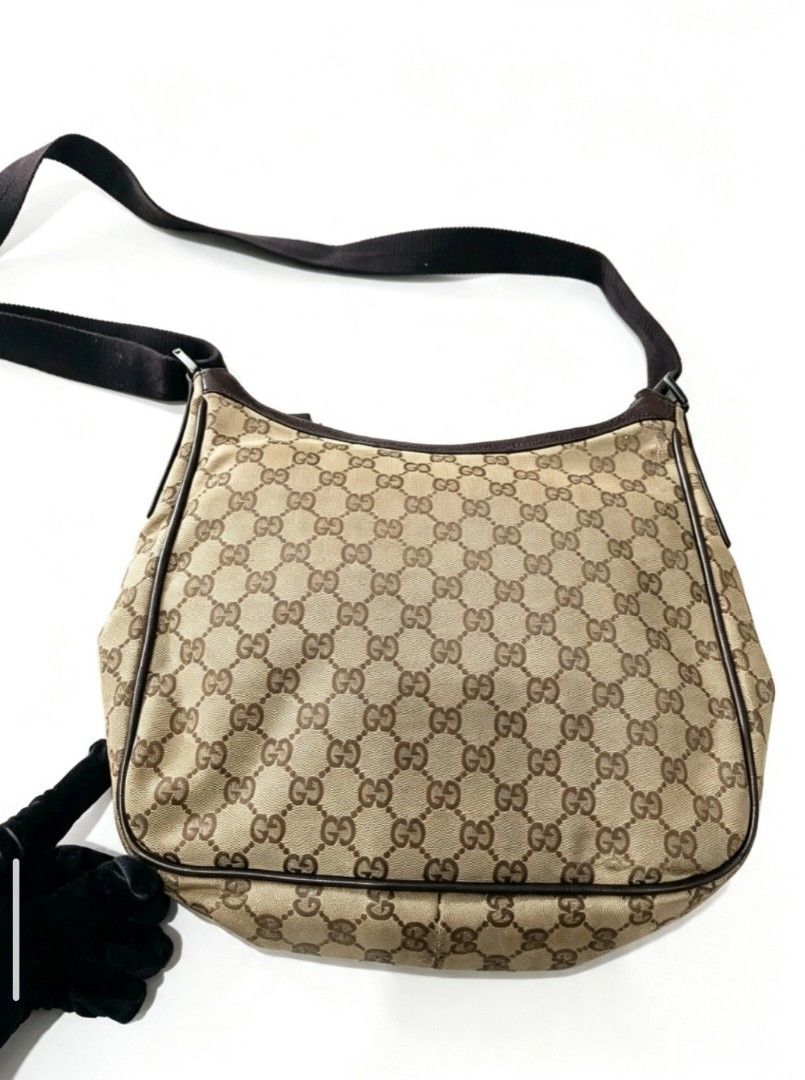 Gucci GG monogram canvas messenger/shoulder bag (Category: Activewear) located in Manila. Submitted by apparell (Listing ID 1461391236, Image 3). Description: Gucci GG monogram canvas messenger/shoulder bag GUARANTEED AUTHENTIC ISSUE MINIMAL FLAW.
