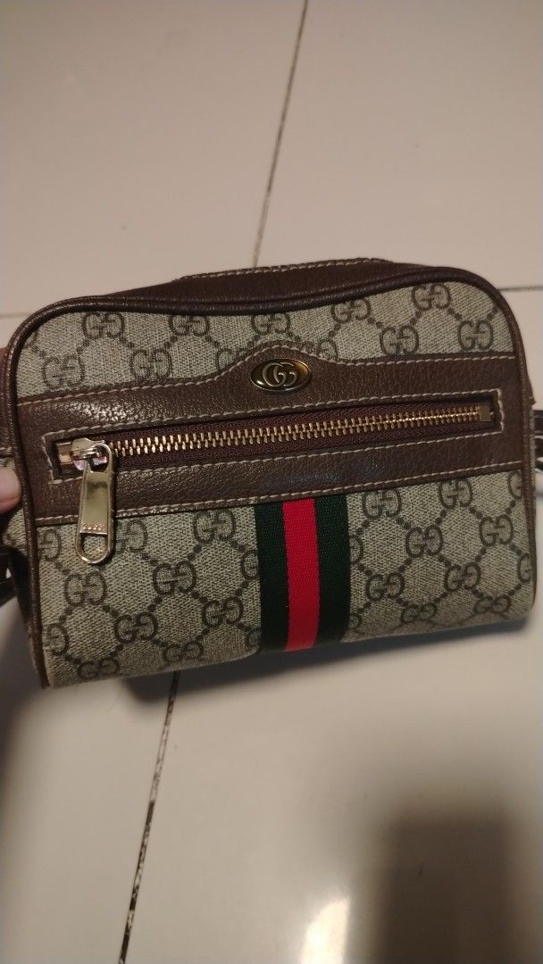 Gucci Monogram Canvas & Leather Web Stripe Crossbody Bag (Category: Luxury Bags & Wallets) located in Manila. Submitted by wildwind_73f77a (Listing ID 1461491930, Image 1). Description: - Gucci crossbody bag - Classic GG monogram canvas with brown leather trim - Iconic green and red web stripe detail - Zipper closure for main compartment - Front zip pocket - Adjustable strap - Ideal for everyday use.