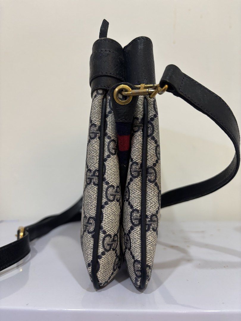 Gucci Monogram Shoulder Bag (Category: Luxury Bags & Wallets) located in Malabon City. Submitted by everythingpreloveddd (Listing ID 1461484313, Image 3). Description: - Classic Gucci shoulder bag - Iconic GG monogram pattern - Black leather trim and strap - Gold hardware details - Small red and blue stripe detail on front flap - Ideal for everyday use.