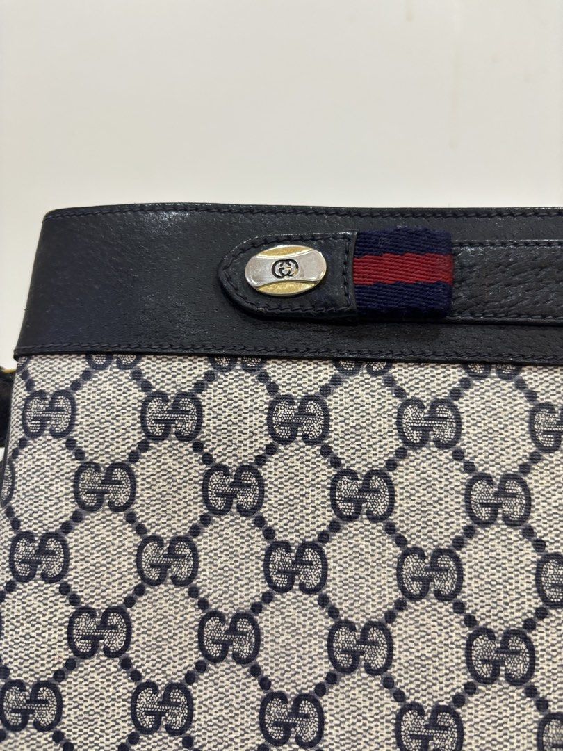 Gucci Monogram Shoulder Bag (Category: Luxury Bags & Wallets) located in Malabon City. Submitted by everythingpreloveddd (Listing ID 1461484313, Image 2). Description: - Classic Gucci shoulder bag - Iconic GG monogram pattern - Black leather trim and strap - Gold hardware details - Small red and blue stripe detail on front flap - Ideal for everyday use.