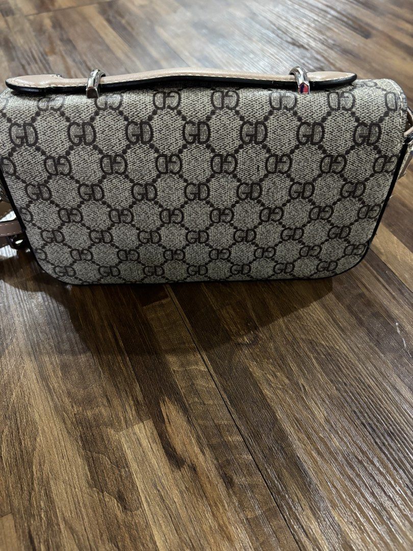 Gucci sling bag (Category: Cross-body Bags) located in Trece Martires City. Submitted by mlmendoza16 (Listing ID 1461332800, Image 2). Description: Gucci bag Good as new Color mocca brown Size small Adjustable strap.