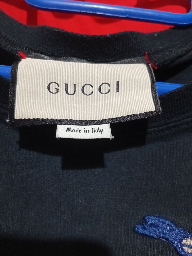 Gucci x Disney T-shirt (Category: Tshirts & Polo Shirts ) located in Iloilo. Submitted by luckytiger.c90343 (Listing ID 1461408010, Image 2). Description: - Authentic Gucci T-shirt featuring a fun Disney character graphic. - Stylish color block design in red, green, and black. - Made in Italy for premium quality. - Size S, perfect for a snug fit. - A must-have for any Gucci and Disney enthusiast!.